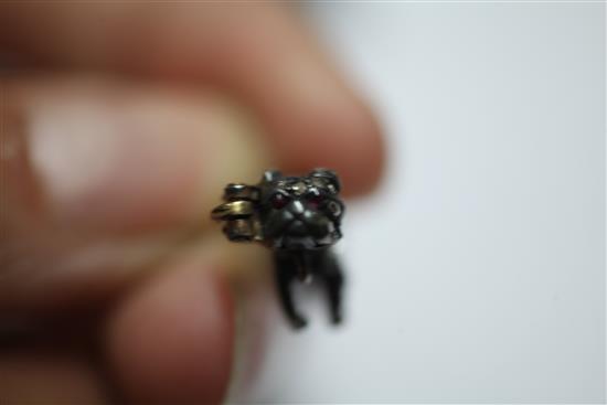 A small Victorian gold and silver, rose cut diamond and cabochon ruby set pug dog brooch, 0.75in.